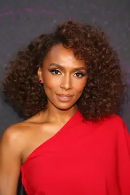Janet Mock curly, natural bob with auburn color