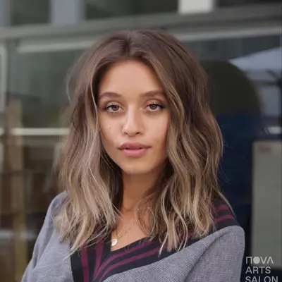 Woman with mushroom brown hair with subtle ombre