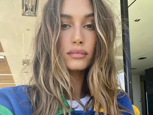 Hailey Bieber with mushroom brown hair.
