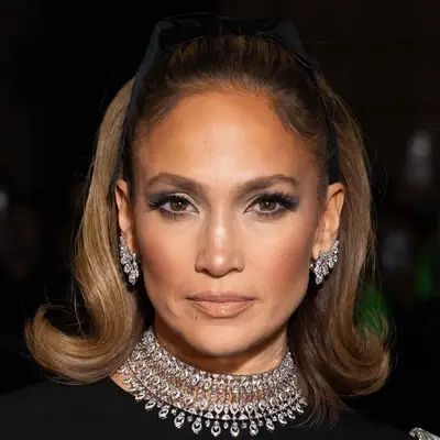 Jennifer Lopez with bow-accented high, ponytail and diamons at the Valentino Haute Couture Spring/Summer 2024