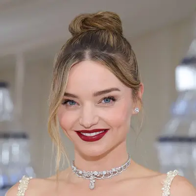 Miranda Kerr with ballerina bun and curtain bans attends The 2023 Met Gala