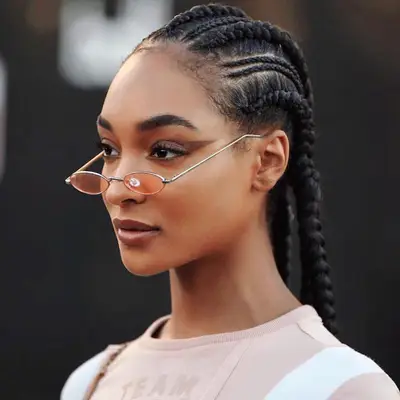 Actor Jourdan Dunn with straight back cornrows, some thin, some thick