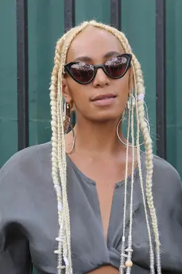 Solange with platinum blonde plaits and cornrows