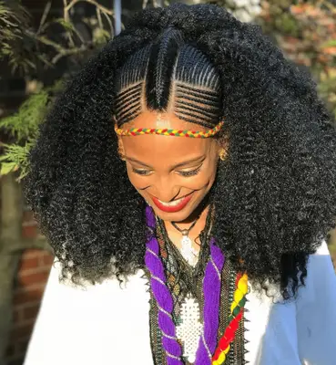 Actor Storm Reid with two French braid-style cornrows 