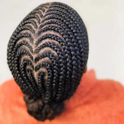 Rear view of a hair cornrowed into a heart-shaped design