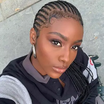 Singer and socialite Justine Skye with micro cornrows, her baby hairs layed