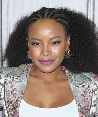 Actress ChantÃ© Adams with a half cornrow, half loose coil hairstyle
