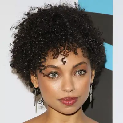 Logan Browning short afro with curly bangs