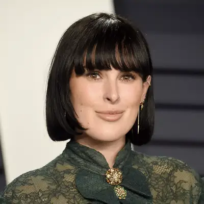 rumer willis posing with black hair and bangs