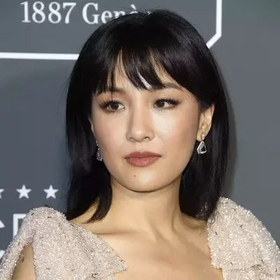 constance wu poses with black hair with bangs