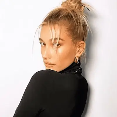 Taraji P. Henson with overdirected side bangs in black lace top