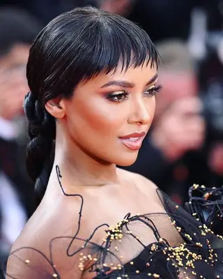 Kat Graham short wispy bangs and braid