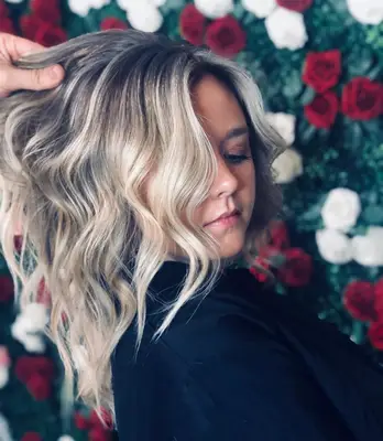 The author, her hair held to the camera by a hairstylist