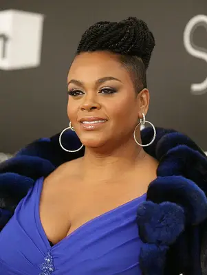 Jill Scott with shaved sides and braided updo