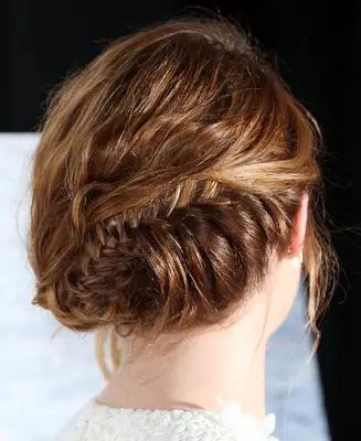 Back of Emma Stone with a fishtail braid updo 