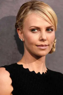 Charlize Theron with a braided side bun