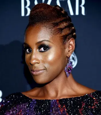 Issa Rae with side cornrows and an updo