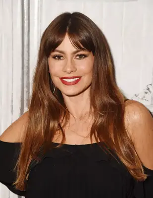Sofía Vergara with long Chesnut hair with curtain bangs