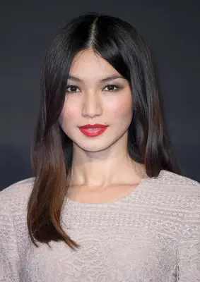 Gemma Chan long, blunt haircut with red lip