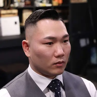 Man with styled haircut with longer top and skin fade sides