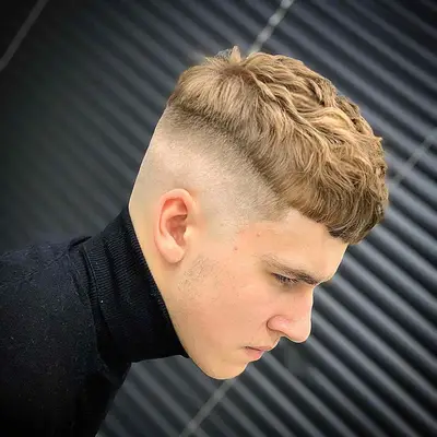 Side view of man with French crop haircut with skin fade