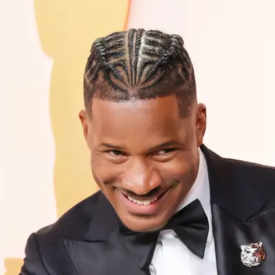 Nate Parker attends the 95th Annual Academy Awards with Braids and High Taper Fade