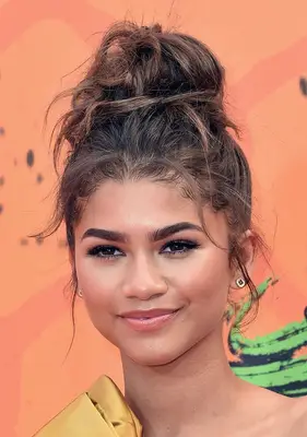 Zendaya with messy top knot