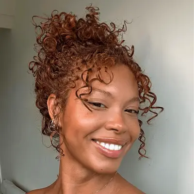 Rihanna attends the 95th Annual Academy Award in glam top knot and all-black outfit