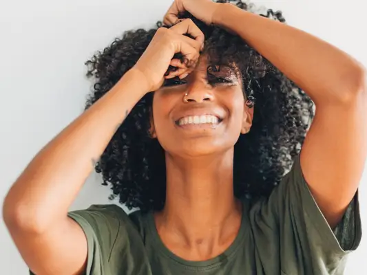 woman playing with curls