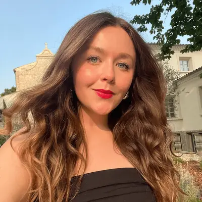 Back of woman with wavy, highlighted hair