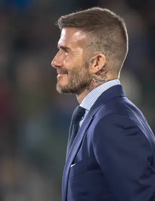 David Beckham shows off scalp tattoo with buzz cut while being inducted into the ring of honor at halftime of the Los Angeles Galaxy