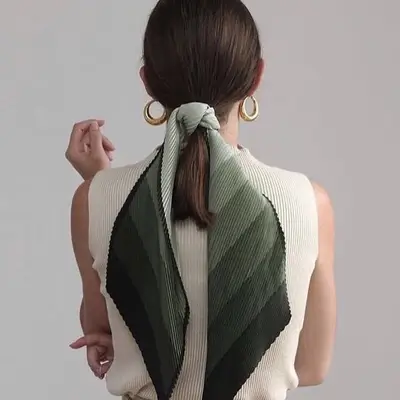 Back view of short ponytail hairstyle with green ombre stripe scarf