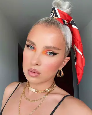 A scarf wrapped around a high bun