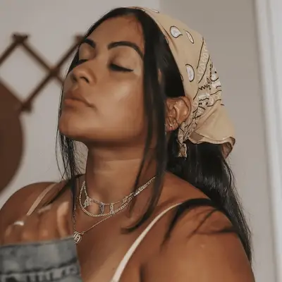 woman with straight hair in bandana