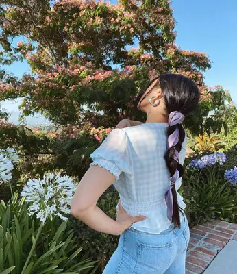 Justine Marjan with a scarf braid