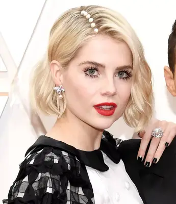 Lucy Boynton with a bedazzled side part