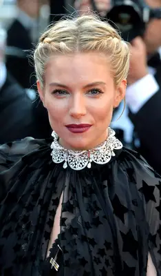 Sienna Miller with a double french-braided updo