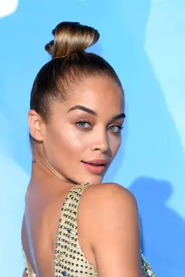 Jasmine Sanders with a sleek topknot