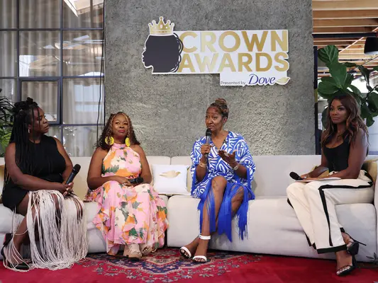 CULVER CITY, CALIFORNIA - JUNE 14: (L-R) Uzo Aduba, LaTosha Brown, Supervisor Holly J. Mitchell, and Tai Beauchamp speak onstage during the 2024 CROWN Awards Presented by Dove at The Blackbird House on June 14, 2024 in Culver City, California. (Photo by Natasha Campos/Getty Images for 2024 CROWN Awards Presented by Dove)