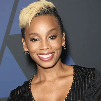 Anika Noni Rose wearing blonde and black faux hawk