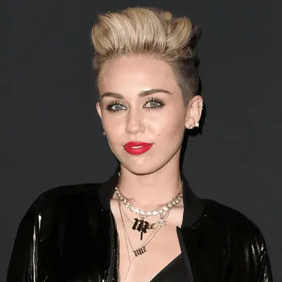 Miley Cyrus wearing blonde faux hawk