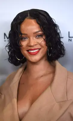 Rihanna with a wet-look curly lob