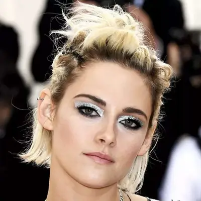 Kristen Stewart at a public event, close-up view of her expression