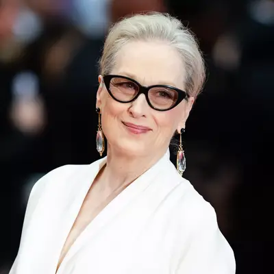 Meryl Streep wears her gray hair in low pulled back style on red carpet