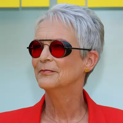Jamie Lee Curtis in a short naturally gray pixie cut