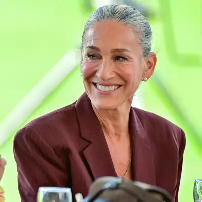 Sarah Jessica Parker in a clean pulled back gray bun