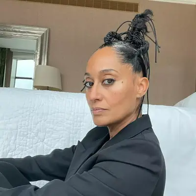 Tracee Ellis Ross in sculptural updo with gray roots