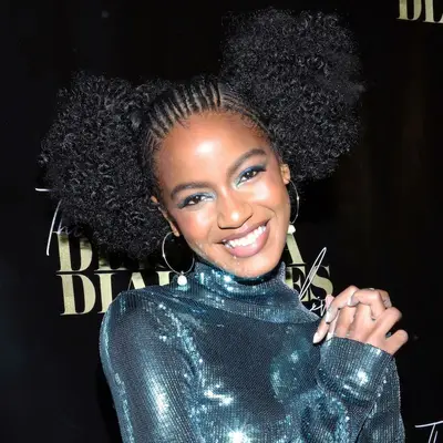 Ebonee Davis with a braided cornrows and curly puffs at the 2019 Diaspora Dialogues Live in Los Angeles
