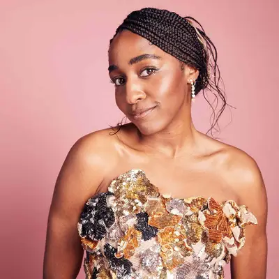 Ayo Edebiri wearing side-parted box braids into a casual pinned-back updo at the 2023 Independent Spirit Awards in Santa Monica, California