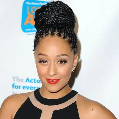 Tia Mowry in a braided topknot hairstyle at the 2014 Actor